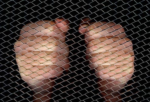 getty rm photo of hands behind screen