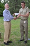 AFOM Director Graham Walker accepts a cheque from CSM Callum Murphy